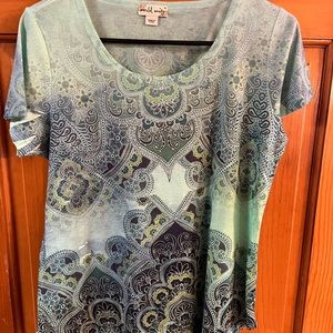 Woman’s soft patterned T-shirt, Green with flower patterns.